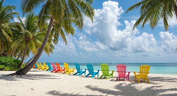 Adirondack Chairs on a Tropical Beach. Add some bright fun Adirondack Chair Cushions for a pop of color